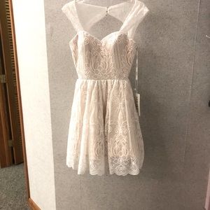 Ivory over nude dress. Very flattering back Size 8